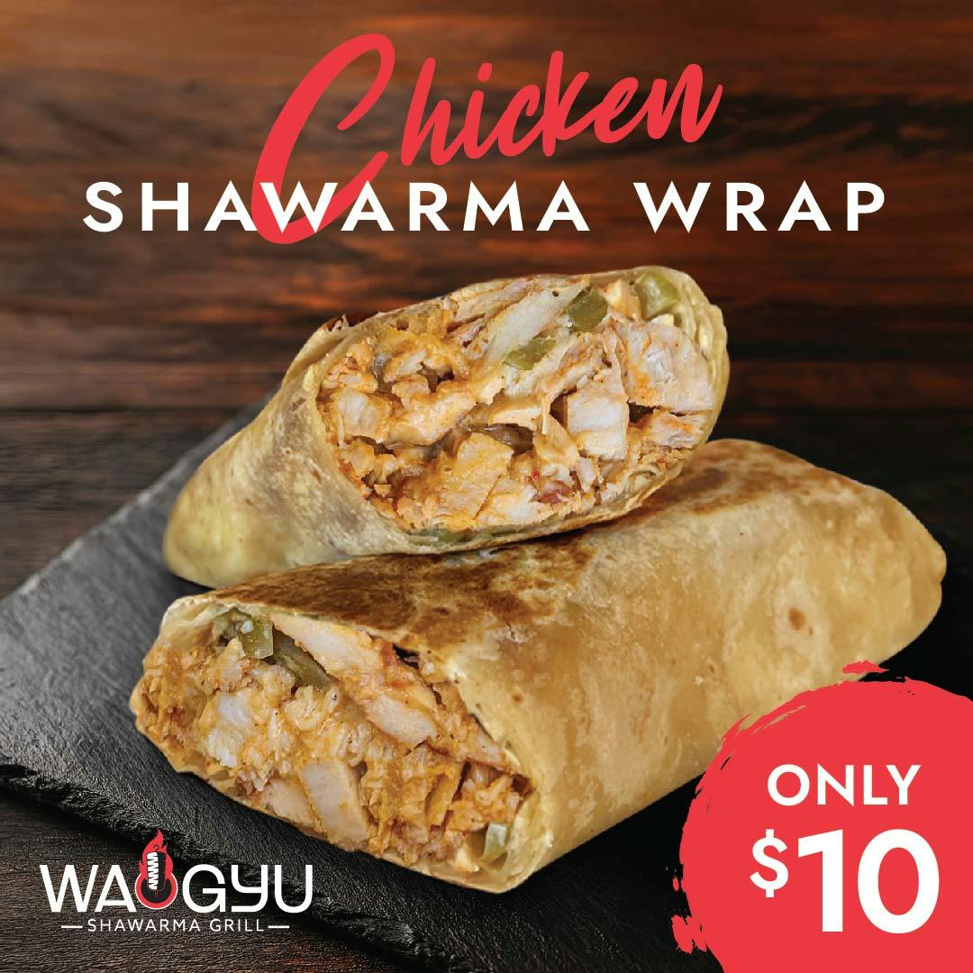 Two toasted chicken shawarma wraps, one cut open to show the filling